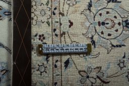 Backside of handmade New Nain rug showing knot structure and weave density