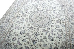 Backside of handmade New Nain rug showing knot structure and weave density