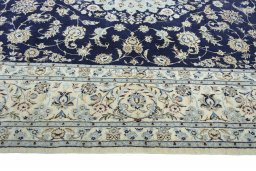 Corner detail of New Nain rug showing border pattern and Cork pile