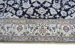 Corner detail of New Nain rug showing border pattern and Cork pile