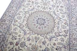 Backside of handmade New Nain rug showing knot structure and weave density