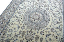 Backside of handmade New Nain rug showing knot structure and weave density