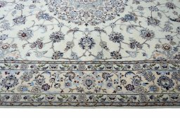 Corner detail of New Nain rug showing border pattern and Cork pile
