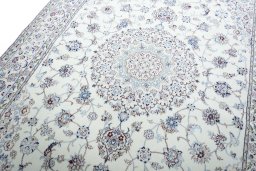 Backside of handmade New Nain rug showing knot structure and weave density