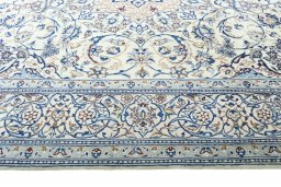 Corner detail of New Nain rug showing border pattern and Wool pile