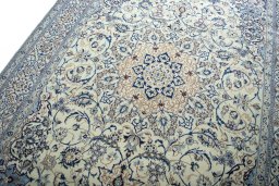 Backside of handmade New Nain rug showing knot structure and weave density