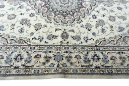 Corner detail of New Nain rug showing border pattern and Cork pile