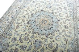Backside of handmade New Nain rug showing knot structure and weave density