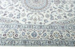 Corner detail of New Nain rug showing border pattern and Cork pile