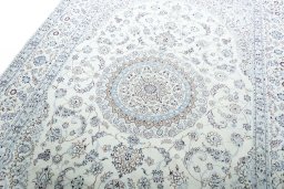 Backside of handmade New Nain rug showing knot structure and weave density