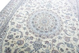 Backside of handmade New Nain rug showing knot structure and weave density