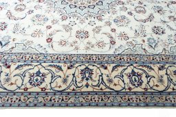 Corner detail of New Nain rug showing border pattern and Cork pile