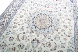 Backside of handmade New Nain rug showing knot structure and weave density