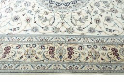 Corner detail of New Nain rug showing border pattern and Cork pile