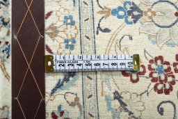 Backside of handmade New Nain rug showing knot structure and weave density