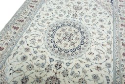 Backside of handmade New Nain rug showing knot structure and weave density