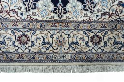 Corner detail of New Nain rug showing border pattern and Cork pile