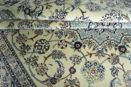 Corner detail of New Nain rug showing border pattern and Cork pile