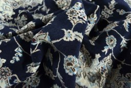 Surface texture of New Nain rug with natural Wool and intricate pattern