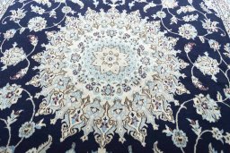Corner detail of New Nain rug showing border pattern and Wool pile