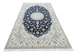 Backside of handmade New Nain rug showing knot structure and weave density
