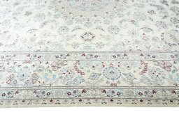 Corner detail of 2000s Nain rug showing border pattern and Wool pile