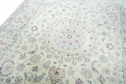 Backside of handmade 2000s Nain rug showing knot structure and weave density