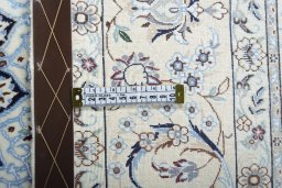Backside of handmade New Nain rug showing knot structure and weave density