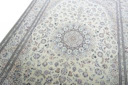 Backside of handmade New Nain rug showing knot structure and weave density