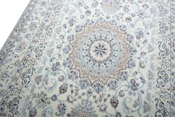 Backside of handmade New Nain rug showing knot structure and weave density