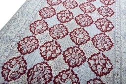 Backside of handmade New Nain rug showing knot structure and weave density