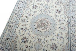 Backside of handmade New Nain rug showing knot structure and weave density