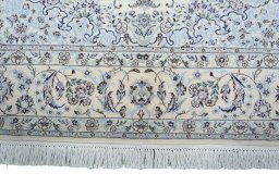Corner detail of New Nain rug showing border pattern and Cork pile