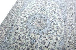 Backside of handmade New Nain rug showing knot structure and weave density
