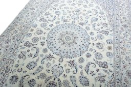 Backside of handmade New Nain rug showing knot structure and weave density