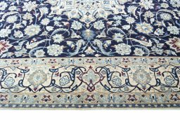 Close-up detail of 2000s Nain rug from Iran / Persia showing Wool weave