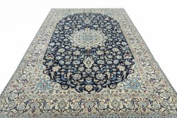 Surface texture of 2000s Nain rug with natural Wool and intricate pattern