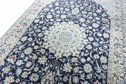 Backside of handmade 2000s Nain rug showing knot structure and weave density