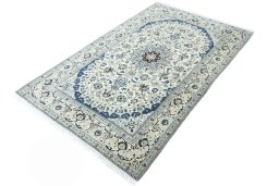 Corner detail of 2000s Nain rug showing border pattern and Wool pile