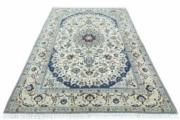 Surface texture of 2000s Nain rug with natural Wool and intricate pattern