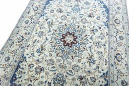 Backside of handmade 2000s Nain rug showing knot structure and weave density