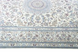 Corner detail of 2000s Nain rug showing border pattern and Wool pile