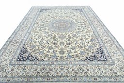 Surface texture of 2000s Nain rug with natural Wool and intricate pattern