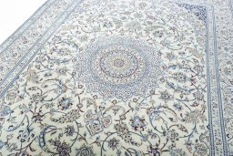 Backside of handmade 2000s Nain rug showing knot structure and weave density