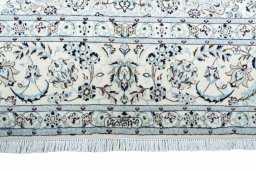 Corner detail of New Nain rug showing border pattern and Cork pile
