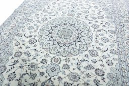 Backside of handmade New Nain rug showing knot structure and weave density