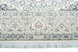 Corner detail of 2000s Nain rug showing border pattern and Cork pile