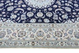 Corner detail of New Nain rug showing border pattern and Cork pile