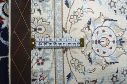 Backside of handmade New Nain rug showing knot structure and weave density