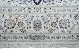 Corner detail of New Nain rug showing border pattern and Cork pile
